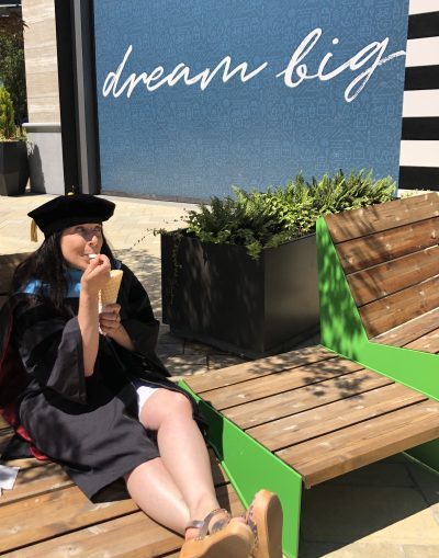 eating ice cream in my gown hood and beanie