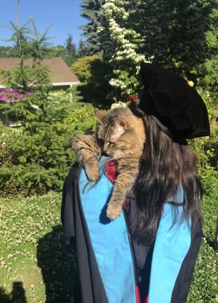 wearing my hood and tam with my cat